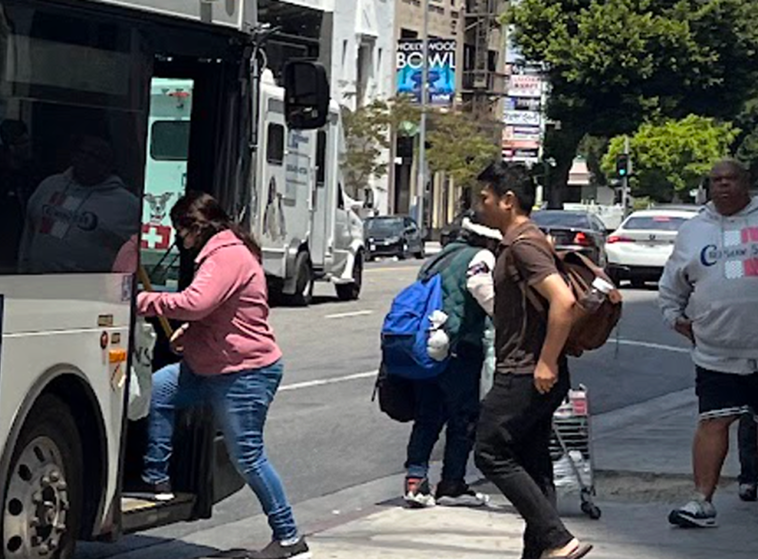 Riders boarding a bus