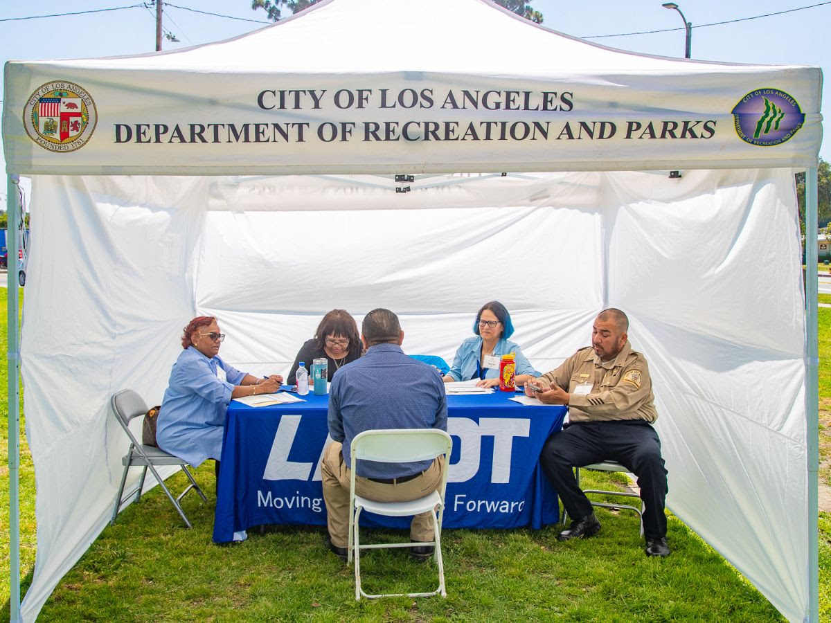 photo of LADOT staff at the career fair sitting in a booth